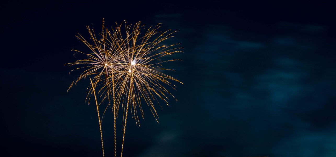 Orange Fireworks Blue Background